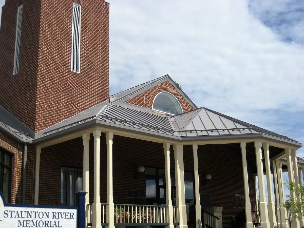 Skilled roofing craftsmen working on a residential roof in Eustis